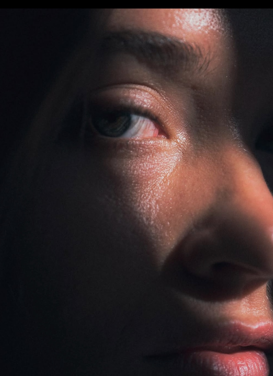 Close portrait lit with warm red light
